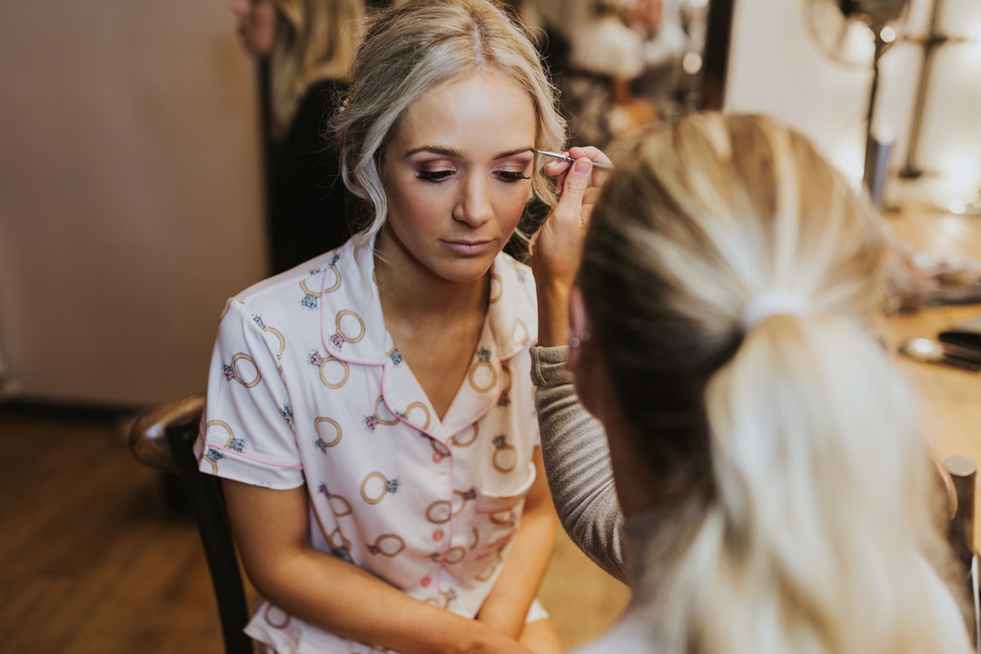 Action Photo of Emily Grosvenor Applying Wedding Day Makeup
